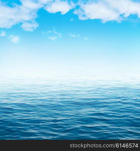 Sea water and blue sky with white clouds. Ocean surface for natural background