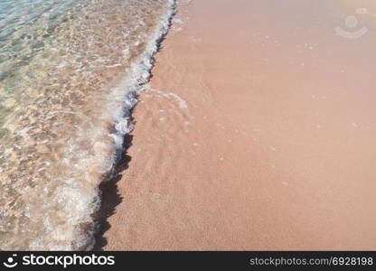 Sea wave on sandy beach