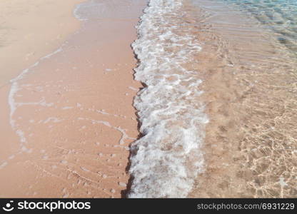 Sea wave on sandy beach