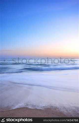sea wave on the beach at sunset time