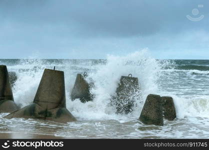 sea waves and breakwaters, storm on the sea and concrete coast protection. storm on the sea and concrete coast protection, sea waves and breakwaters