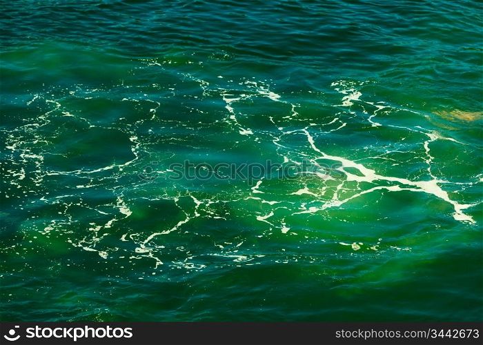 Sea with blue green water wave splash background