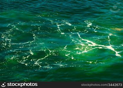 Sea with blue green water wave splash background