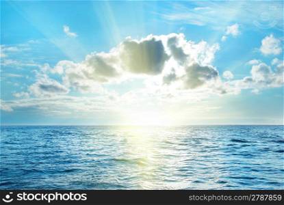 Sea with blue water, sky and clouds. Seascape