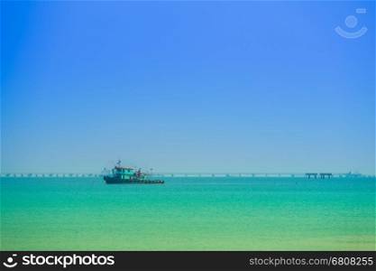 sea with the Thai fishing boat with blue sky