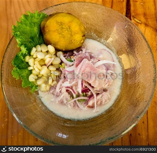 Seafood ceviche raw on background. Traditional dish of Peru or Chile