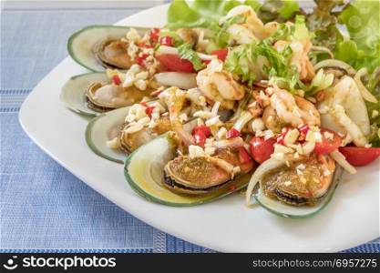 seafood dish with green mussel . seafood dish with green mussel and spicy sauce
