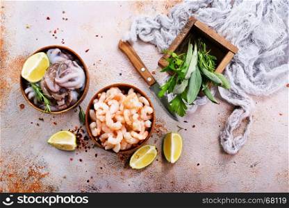 seafood in bowls and on a table