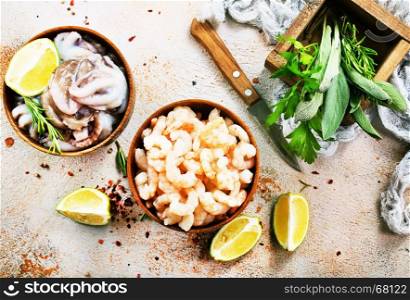 seafood in bowls and on a table