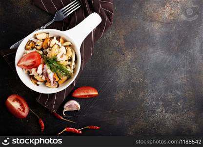 seafood in white bowl on a table