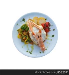 Seafood meal with cod, vegetables, potatoes and crab as decor isolated on white.
