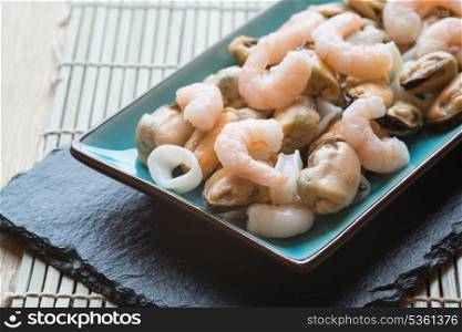 Seafood mix on platter with prawns squid and mussels