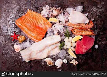 Seafood on the ice. Seafood on the ice, top view on the brown stone background
