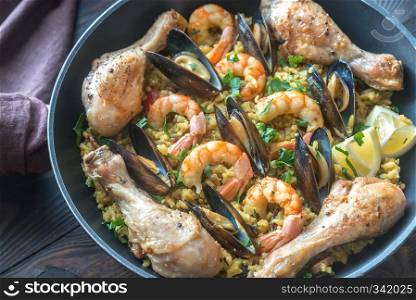 Seafood paella wuth chicken in the pan