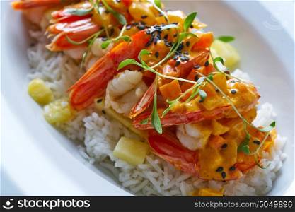 Seafood red curry with shrimps prawns sprouts and sesame seeds