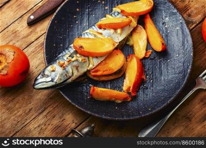 Seafood, roasted mackerel. Fish scomber in persimmon fruit.. Baked fish with persimmon.