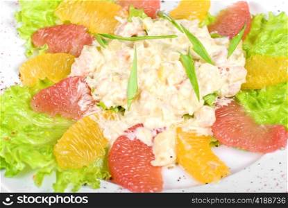 seafood salad of shrimp baked at cream with orange and grapefruit isolated on a white background