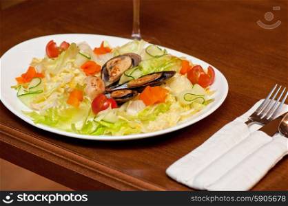 Seafood salad. Seafood salad at plate closeup photo
