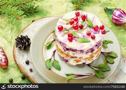 Seafood salad with herring and vegetables.Traditional New Year salad with herring. Christmas salad with herring
