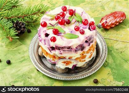 Seafood salad with herring and vegetables.Traditional New Year salad with herring. Christmas salad with herring