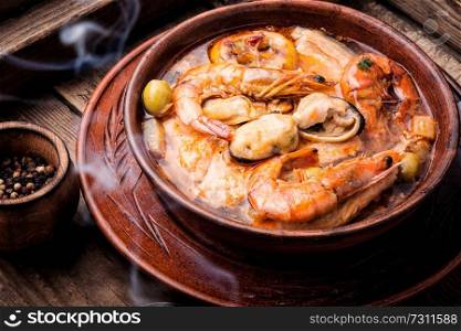 Seafood soup with prawns, mussels and fish. Tom Yam soup with seafood