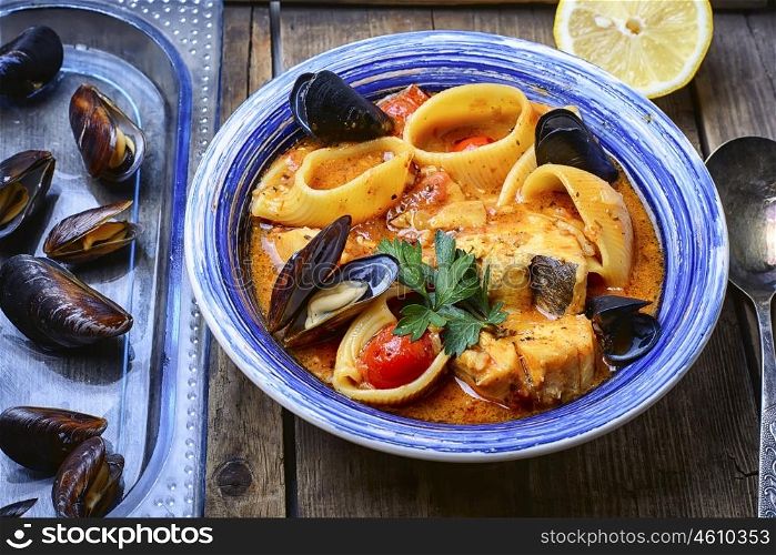 seafood soup with tomato sauce,mussels and pasta