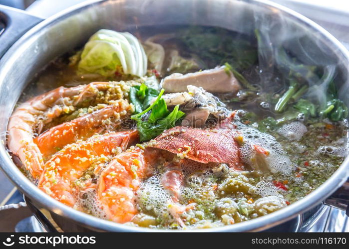 Seafood spicy hot pot crab prawn fish squid tumyum
