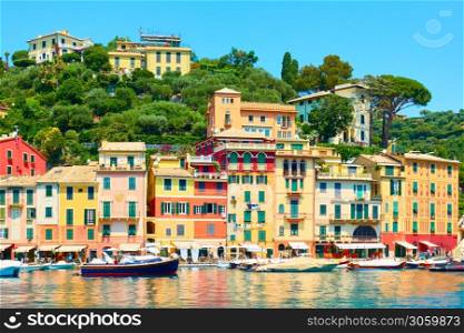 Seafront with colorful houses and small port in Portofino - luxury resort on the Italian riviera in Liguria, Italy