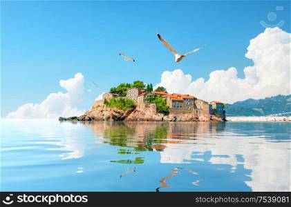 Seagulls and Sveti Stefan island in Montenegro. Sveti Stefan Island