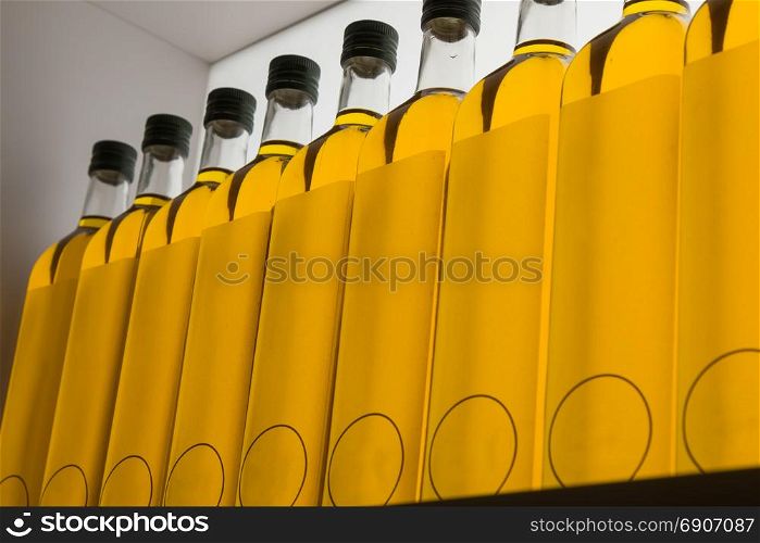 Sealed Olive Oil Bottles in Row