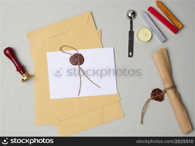 sealed white envelope with brown wax seal on beige background