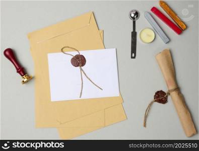 sealed white envelope with brown wax seal on beige background