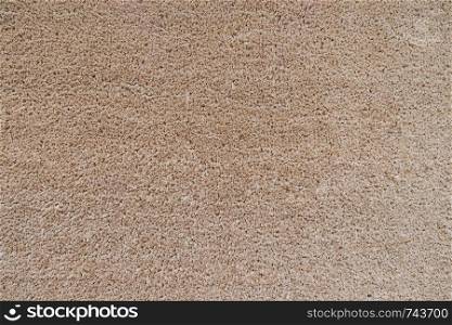 Seamless neutral brown carpet texture background.