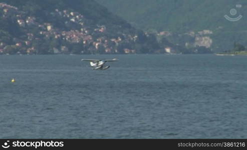 Seaplane landing on Lake Como in Italy