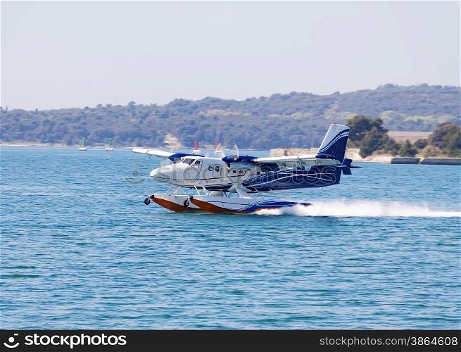 seaplane landing on sea surface