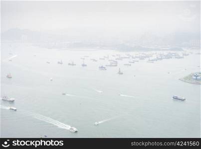 Seaport in Hong Kong . Some 456,000 vessels arrived in and departed from Hong Kong during the year, carrying 243 million tonnes of cargo