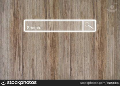 Search bar online browsing on wood table. Idea for searching browse data information networking