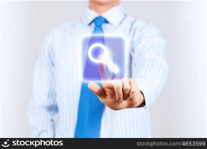 Search icon. Close up of businessman touching search icon