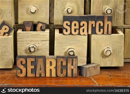 search word or SEO concept - vintage letterpress wood type with primitive apothecary drawer cabinet