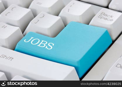 Searching for job on the internet. Jobs button on computer keyboard .