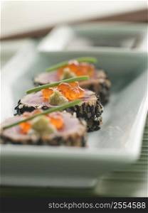 Seared Yellow Fin Tuna Rolled in Sesame seeds with Wasabi and Salmon Roe