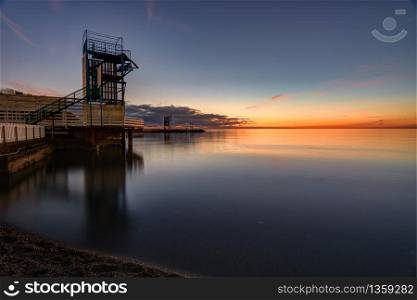 Seascape and wharf in the small bay of Anapa, Russia after sunset