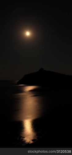 Seascape at night. The coastline moonlight and stars in the sky. Noviy Svet, Crimea, Ukraine