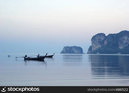 seascape photo of fishing boat in the sea with beautiful sky background