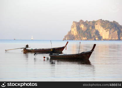 seascape photo of fishing boat in the sea with beautiful sky background