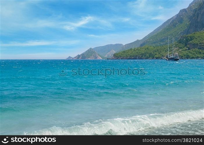 seascape, sailing ship and the mountainous coast