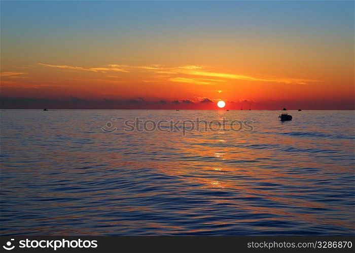 seascape sunrise first sun orange in blue sea ocean