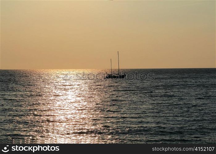 Seascape with calm water and beautiful sailboat