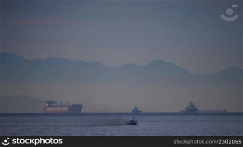 Seascape with cargo container industrial ships on Strait of Gibraltar. Logistic shipping concept.. Sea with cargo ships, Strait of Gibraltar