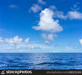 seascape with clouds and blue sky background